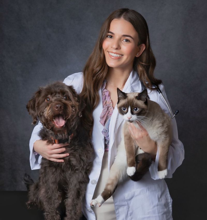 Steph Acosta holding dog and cat