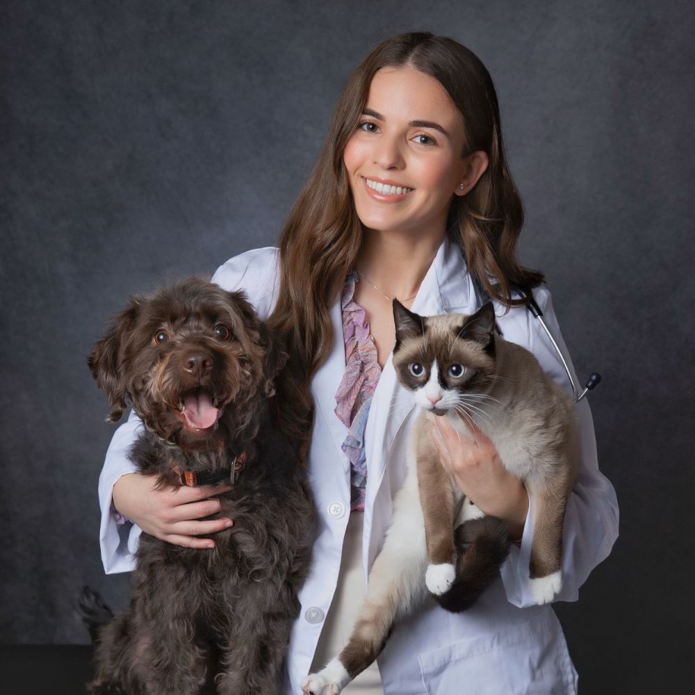 Stephanie Acosta holding dog and cat